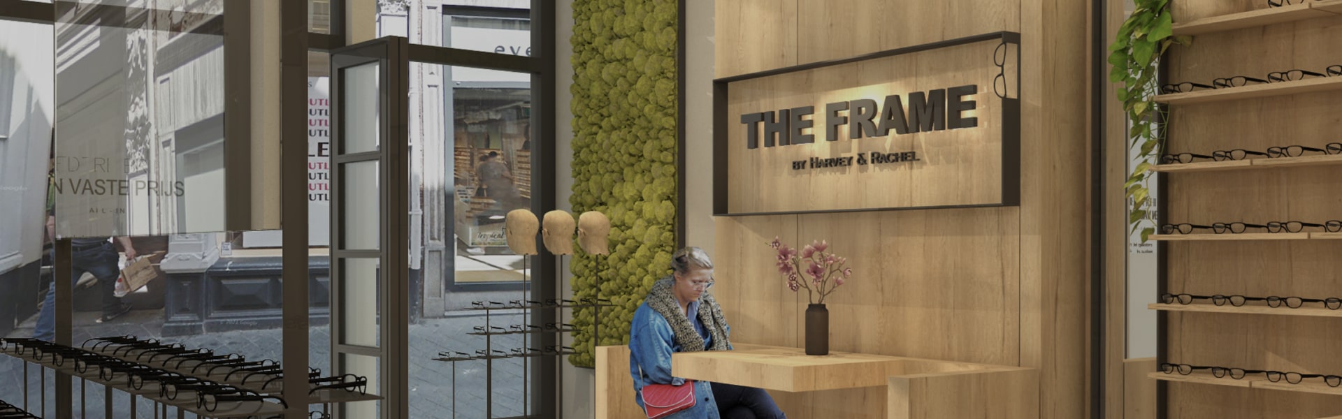 De winkel van The Frame met eiken wand en moswand